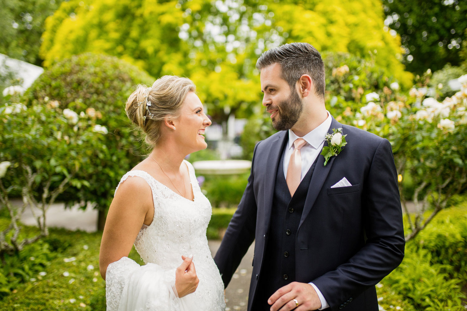 bride and groom sharing a joke