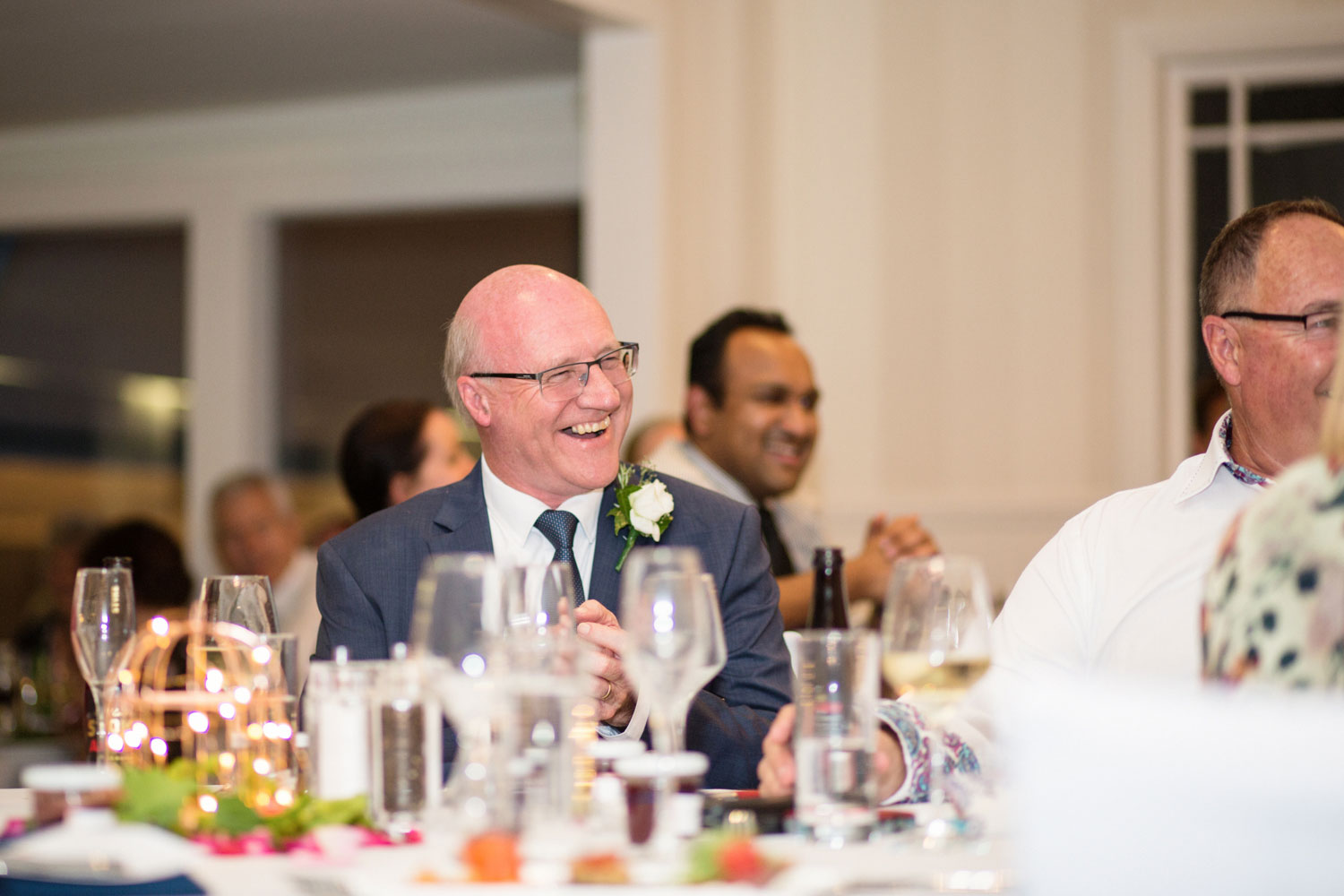 father of the bride laughing