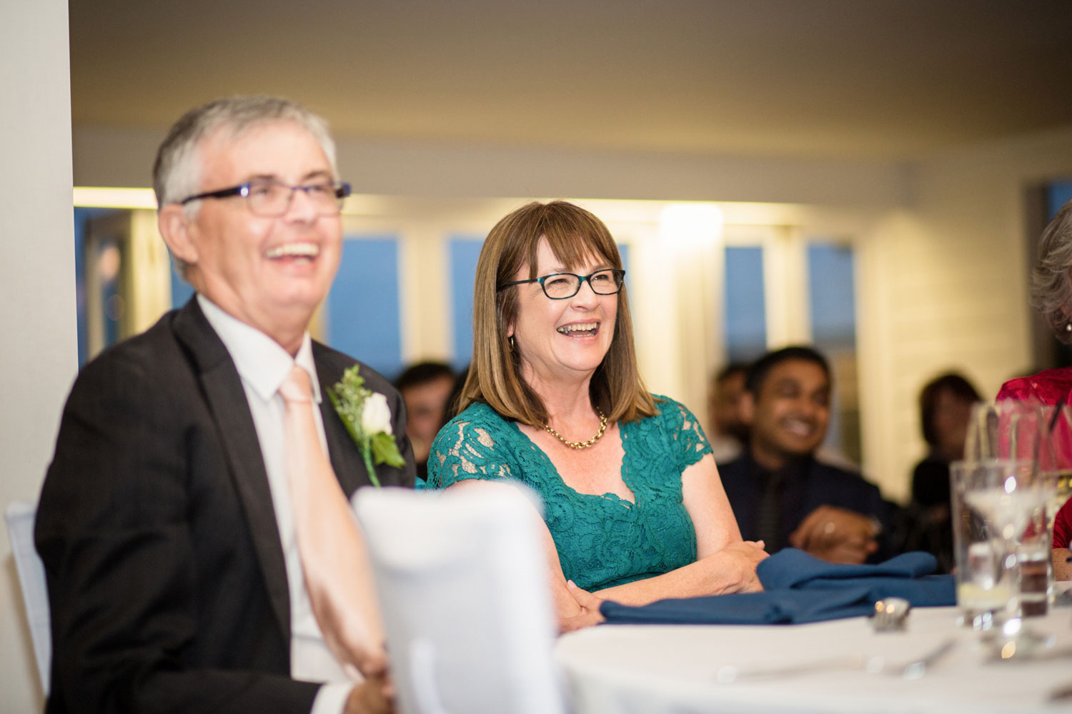 mother of the groom laughing