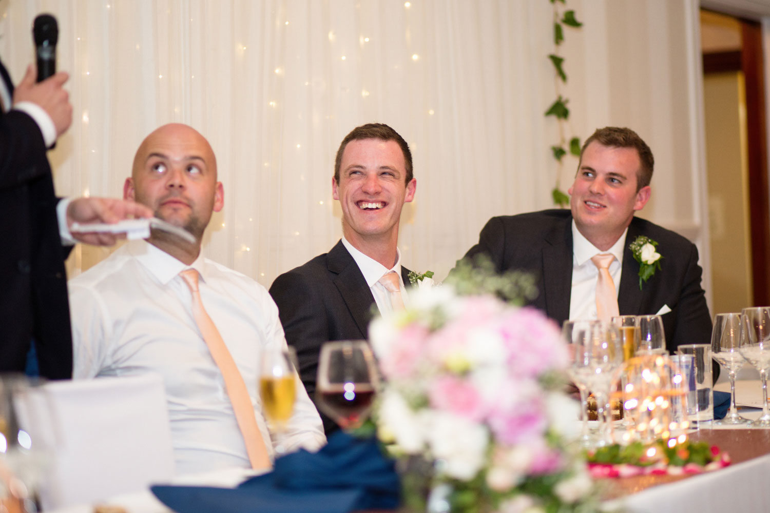 groomsmen laughing