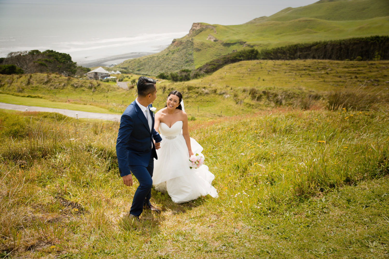 castaways waiuku wedding bride and groom walking