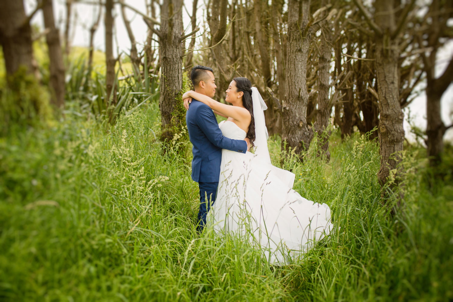 castaways waiuku wedding bride and groom embrace