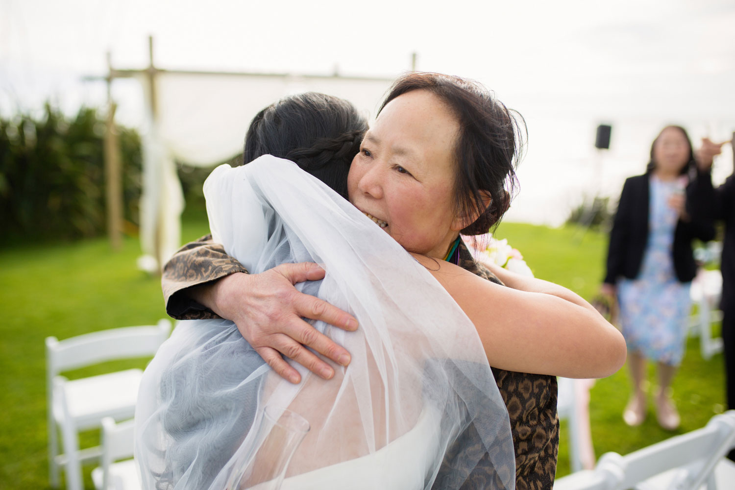 castaways waiuku wedding relative hugging bride