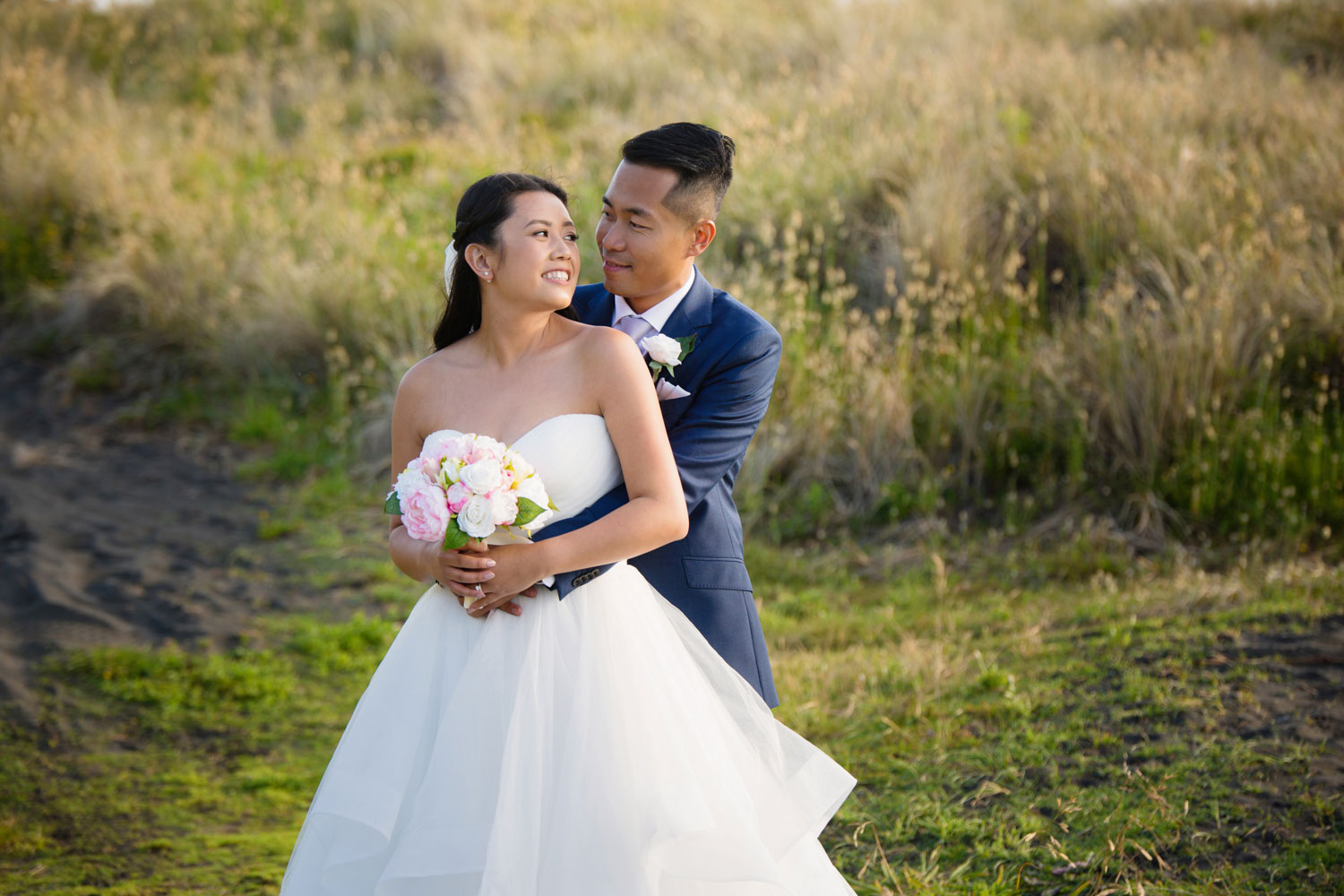 castaways waiuku wedding bride looking at the groom