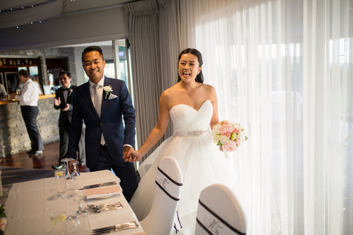 castaways waiuku wedding bride and groom arrive at reception