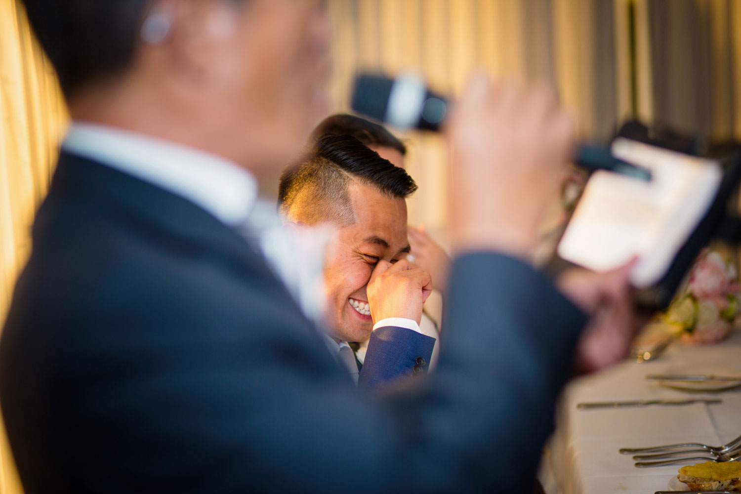 castaways waiuku wedding groom laughing