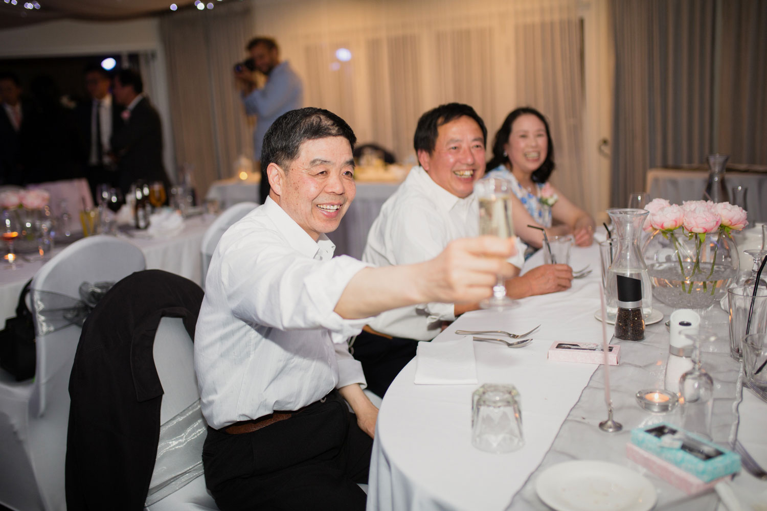 castaways waiuku wedding guests giving a toast