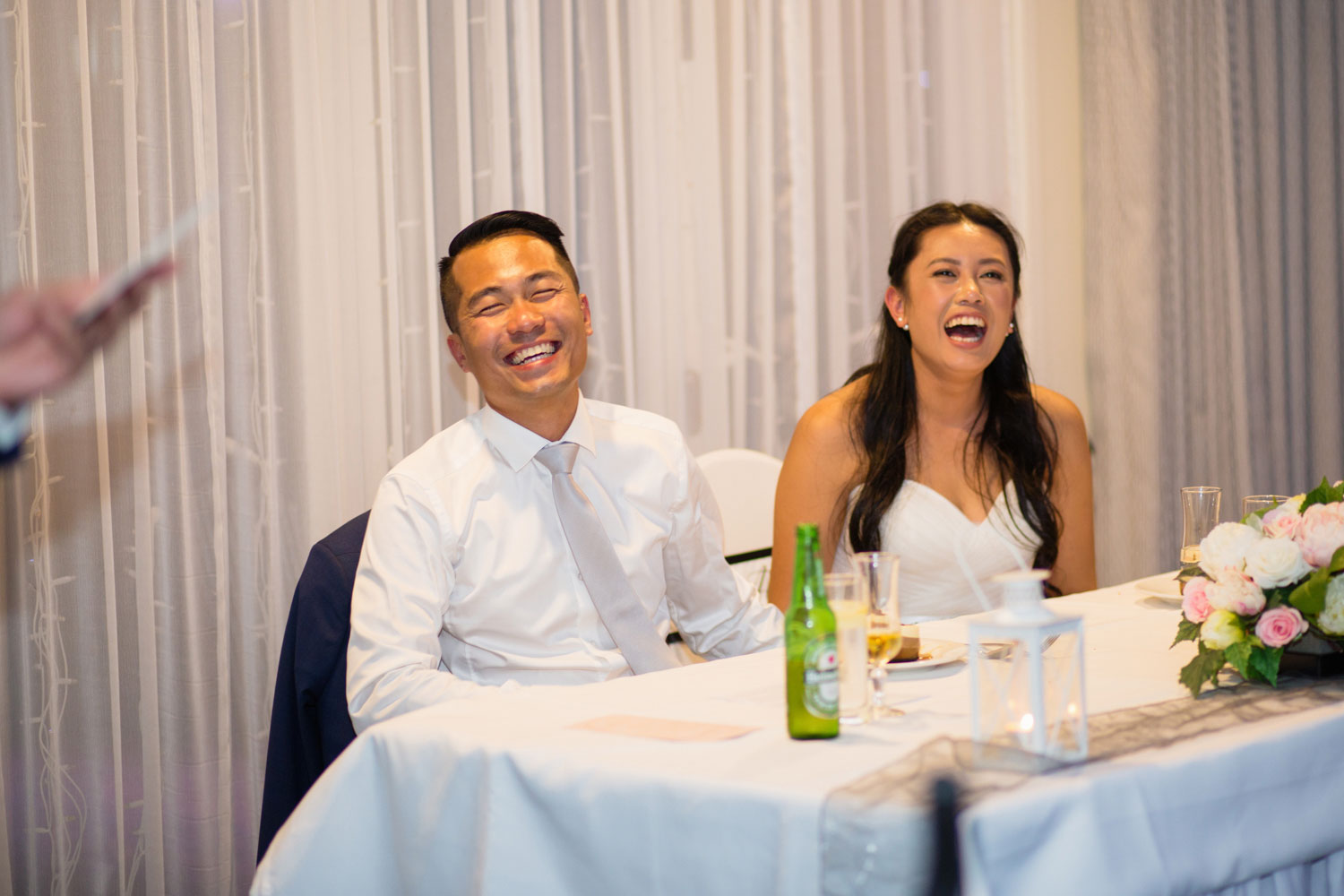 castaways waiuku wedding bride and groom having a good time