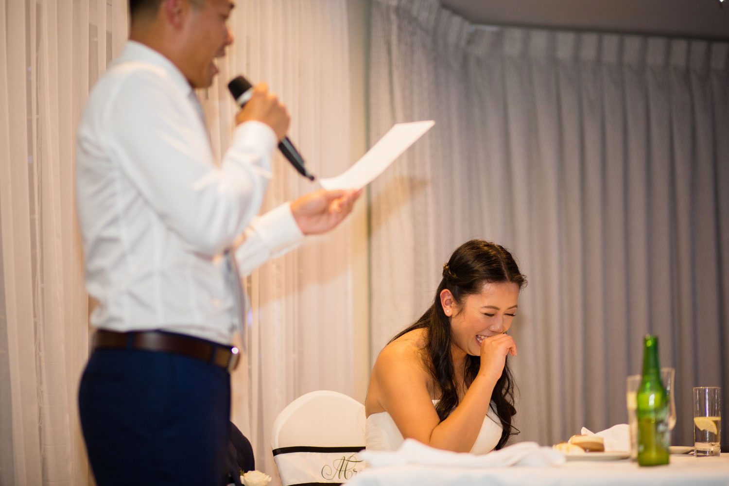 castaways waiuku wedding bride laughing at speech