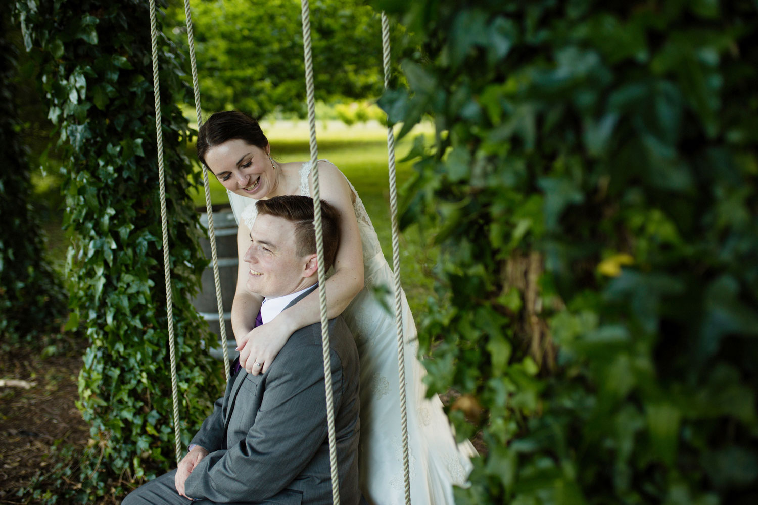 bride and groom on the swing