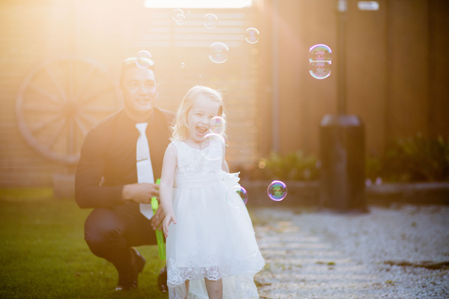 child playing with bubbles