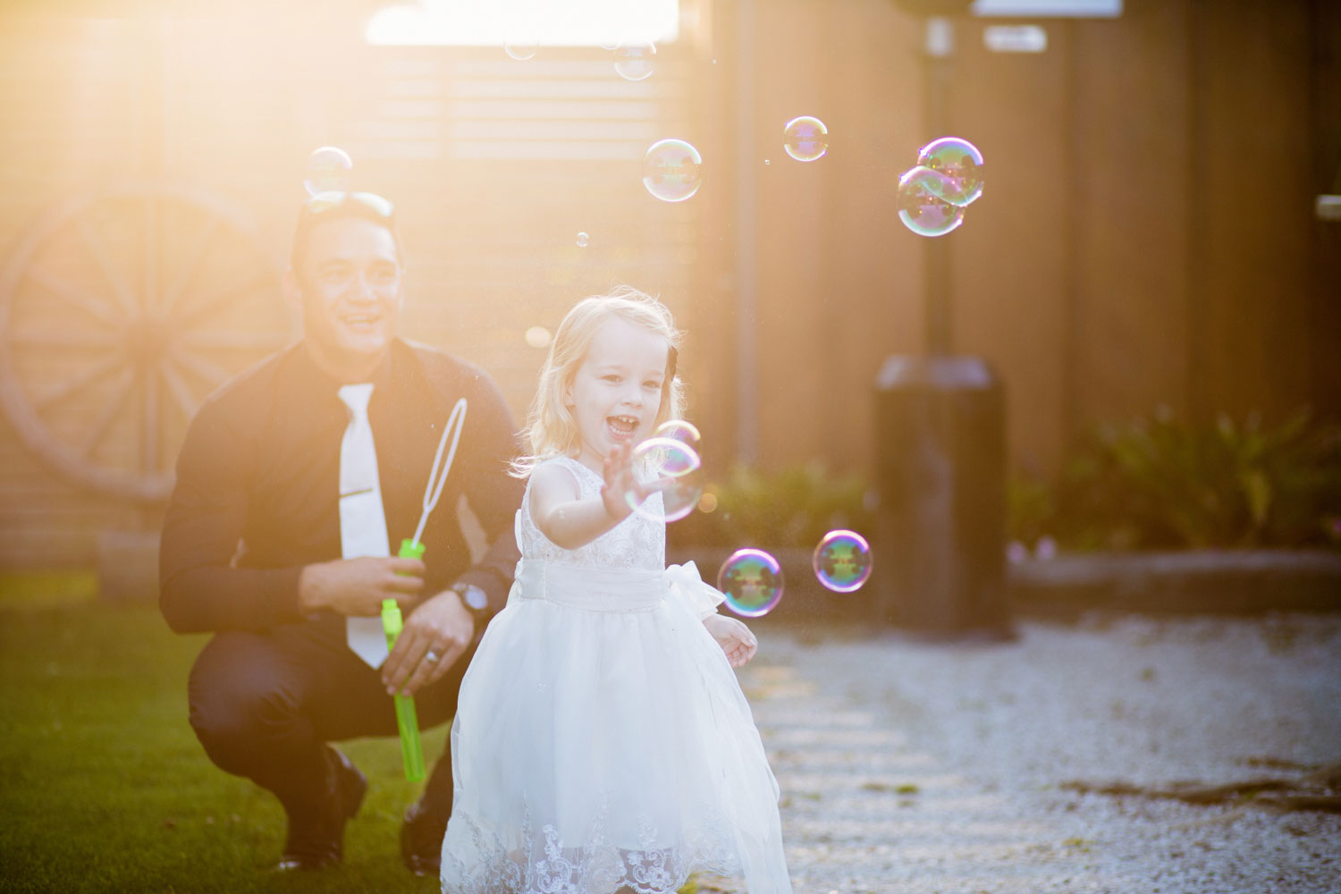 child playing with bubbles