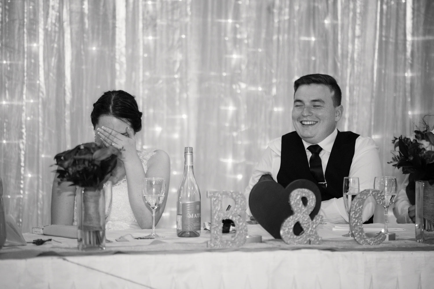 bride and groom laughing