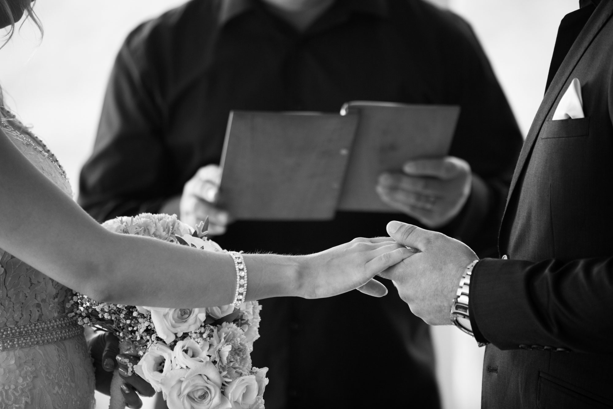 bride and groom holding hands