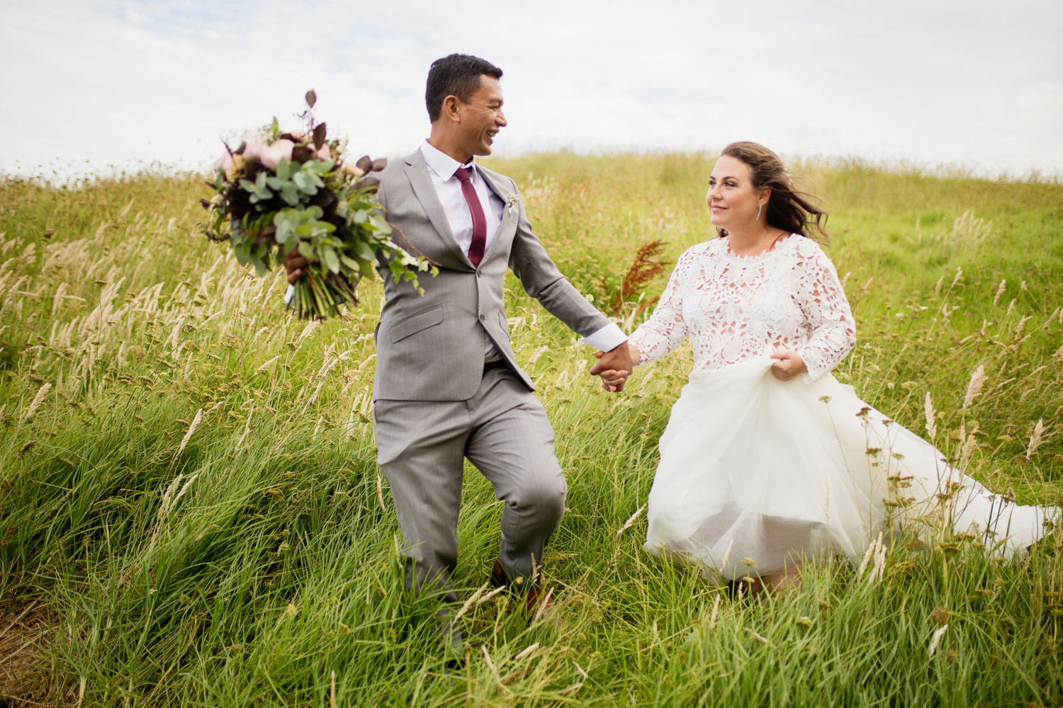 bride holding groom hand