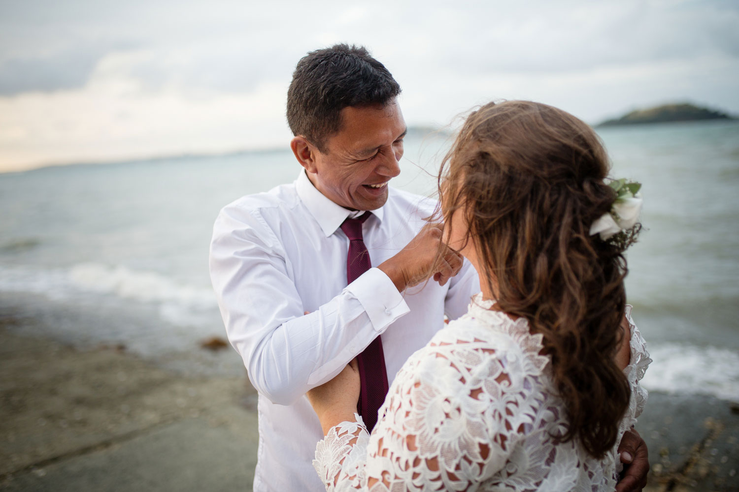 groom laughing with bride