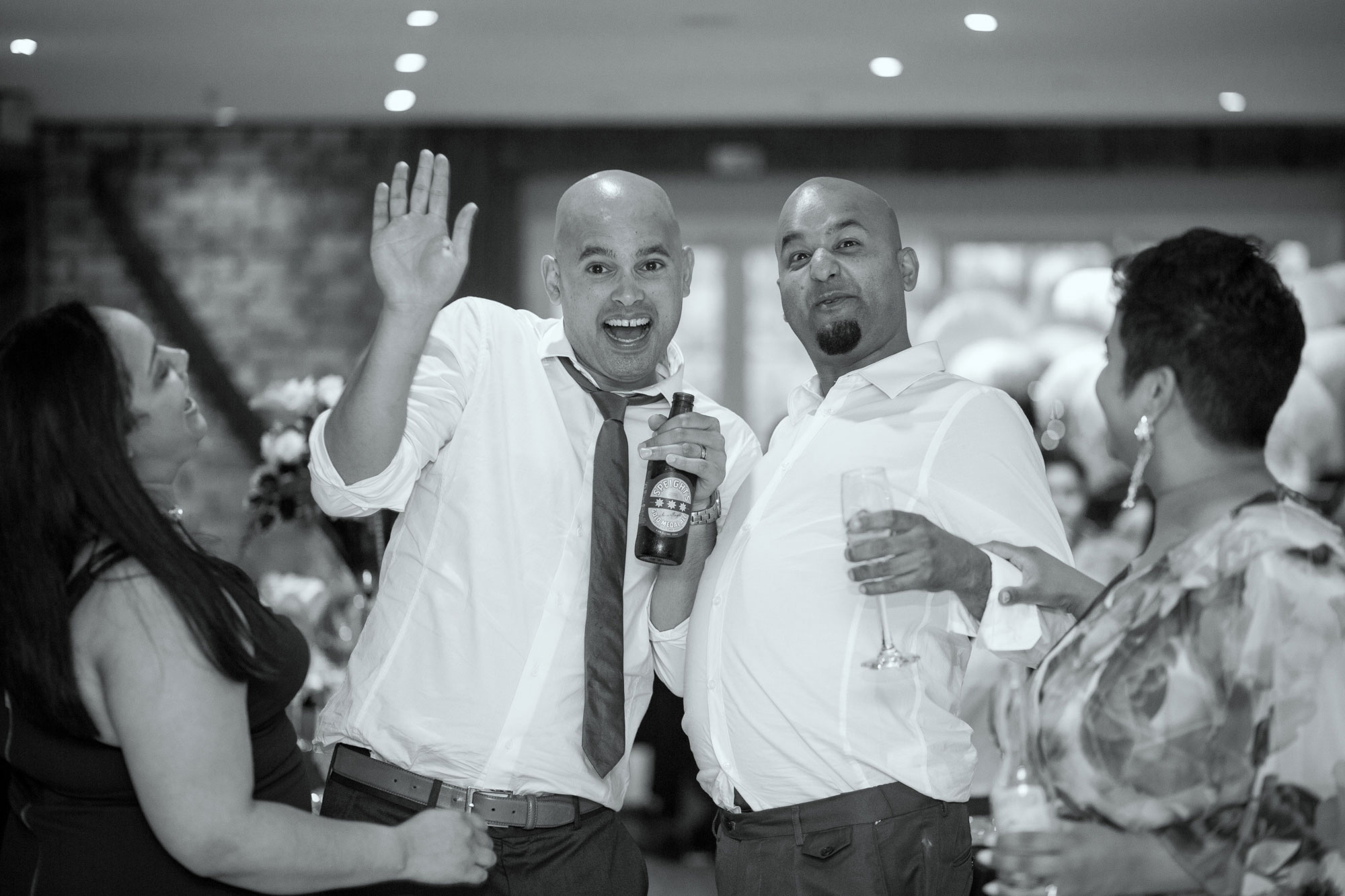 wedding guests waving at camera