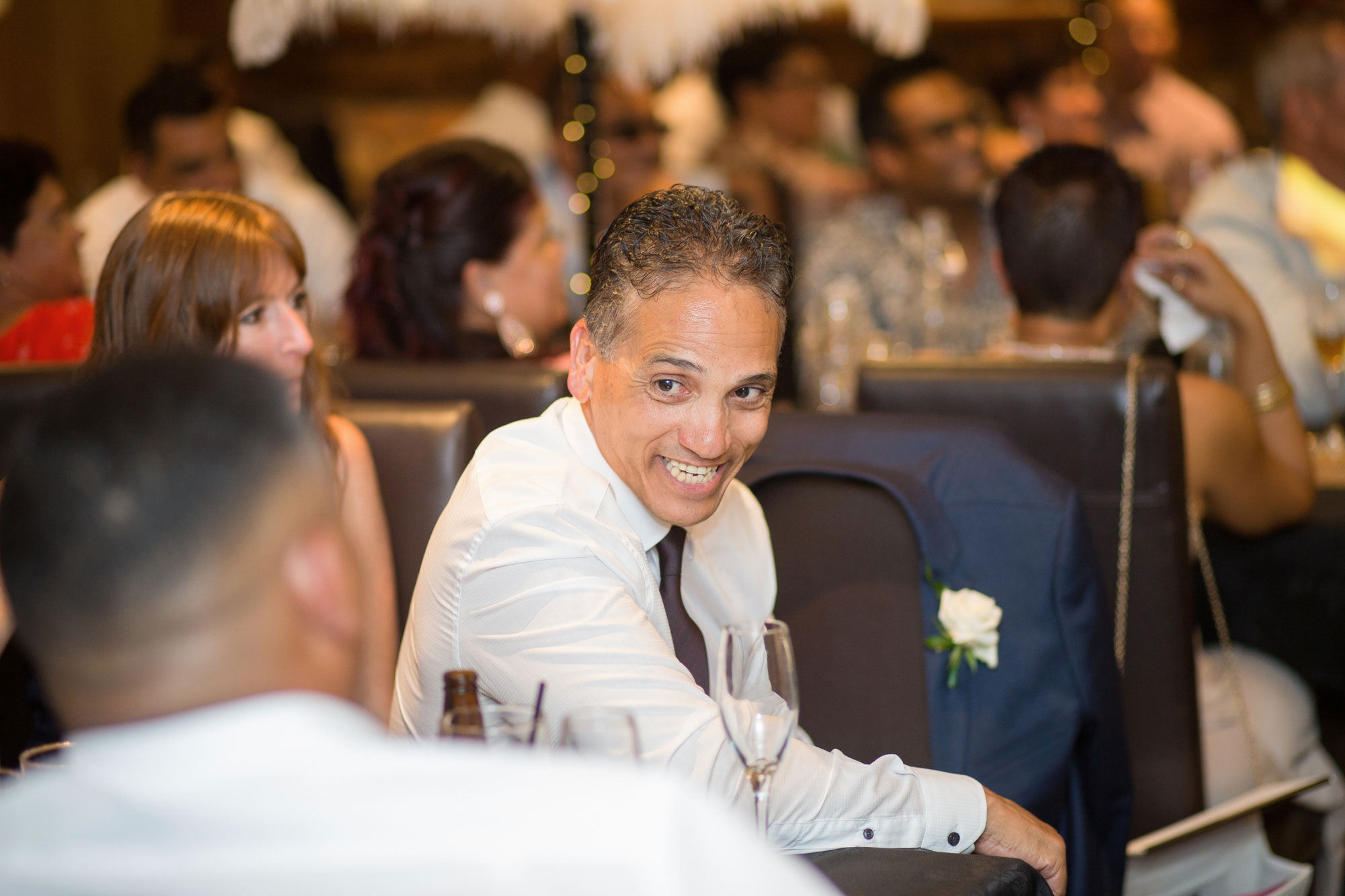 father of the groom laughing