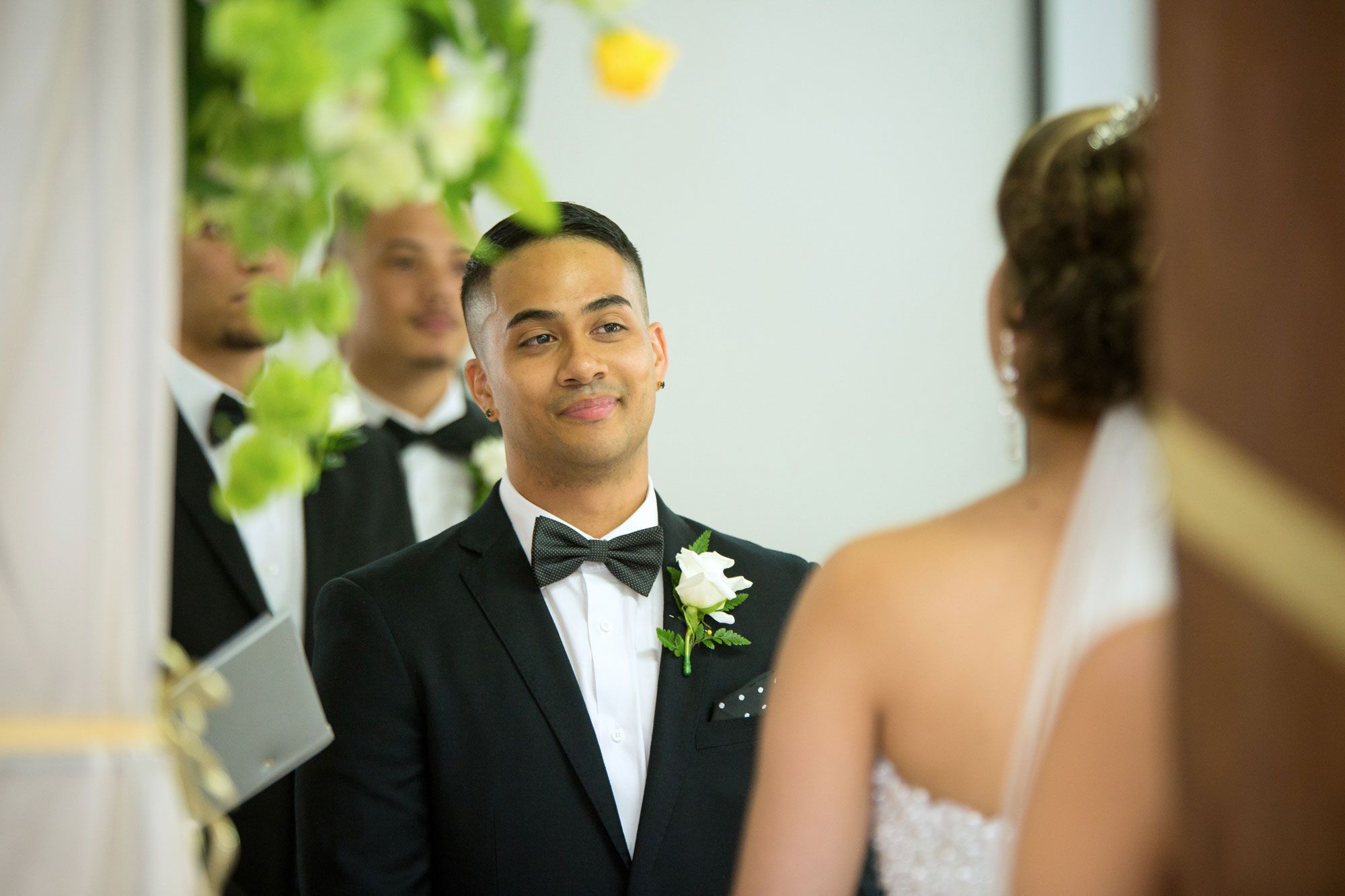 groom looking at bride