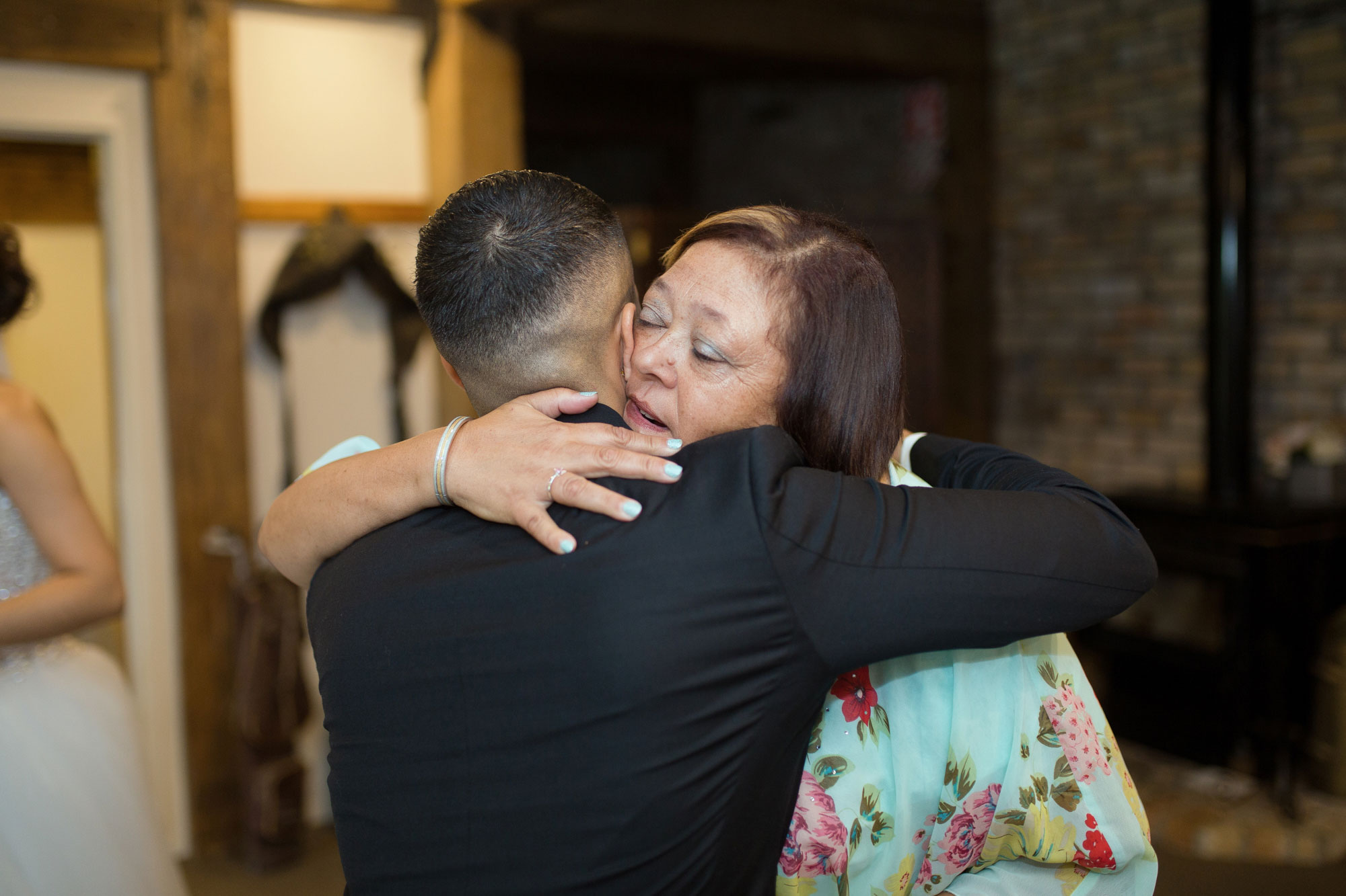 guest hugging groom