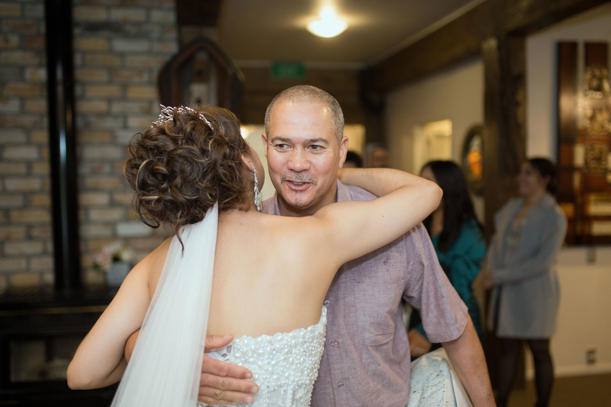 guest hugging bride