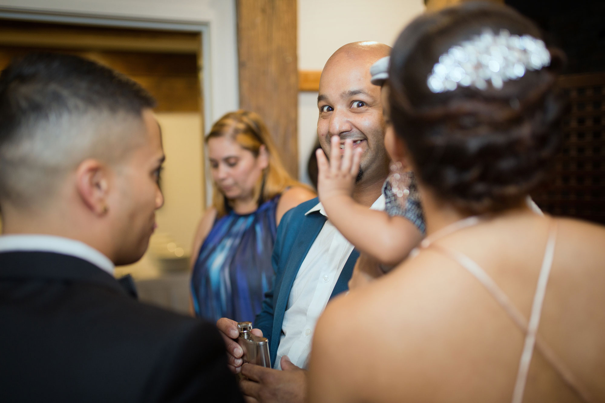 wedding guest talking to bride and groom