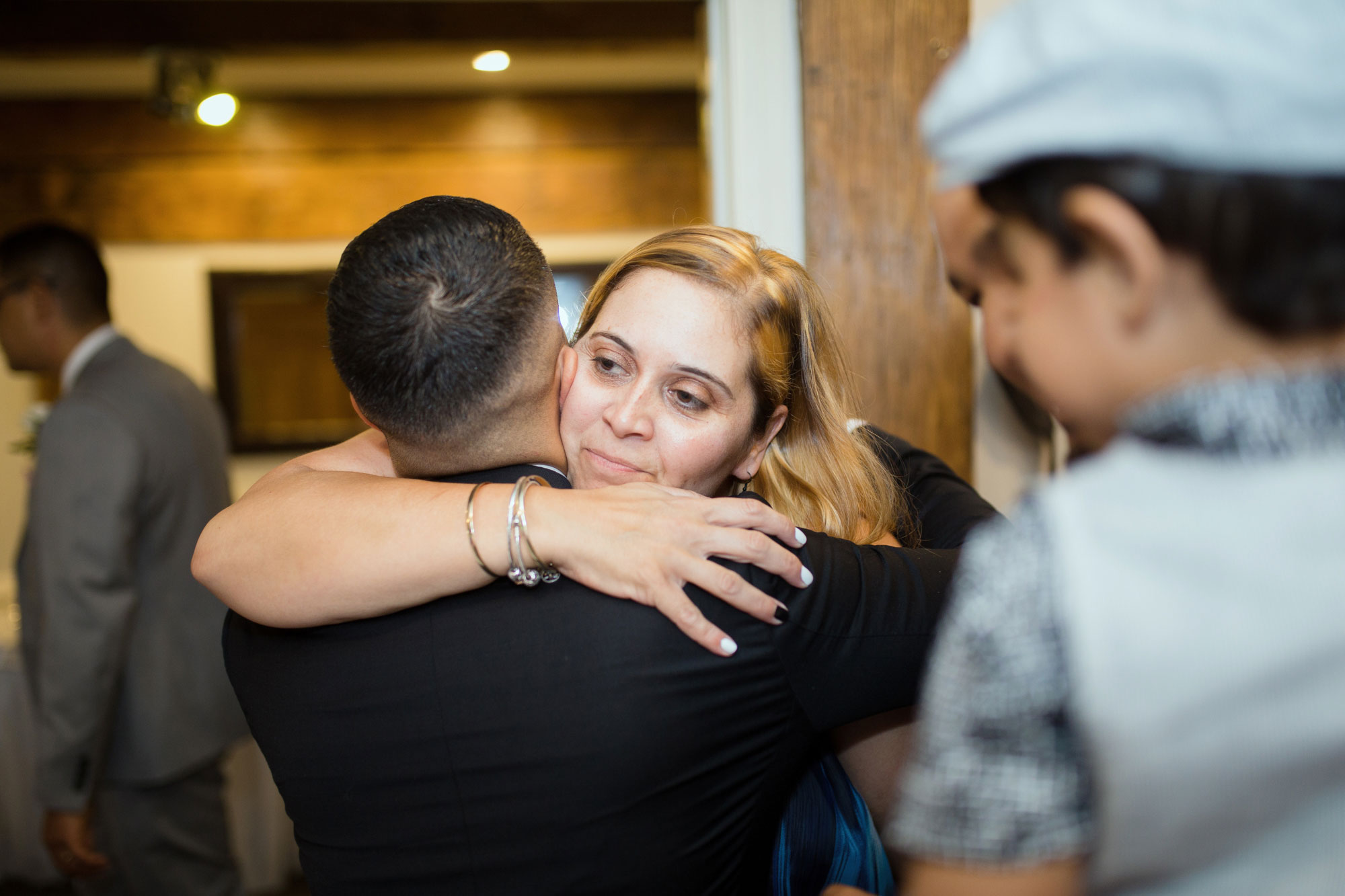 guest hugging groom