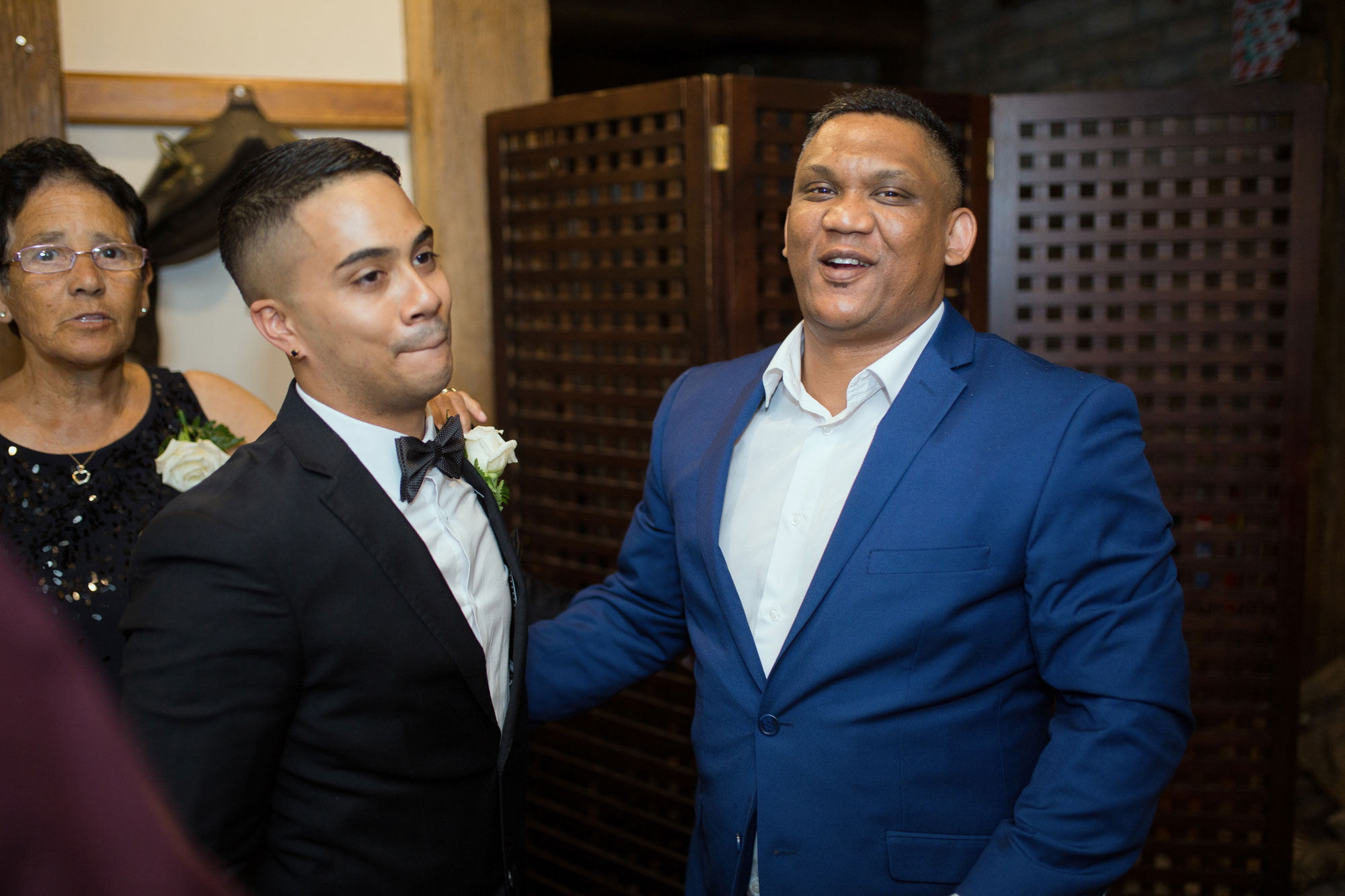 guest and groom laughing