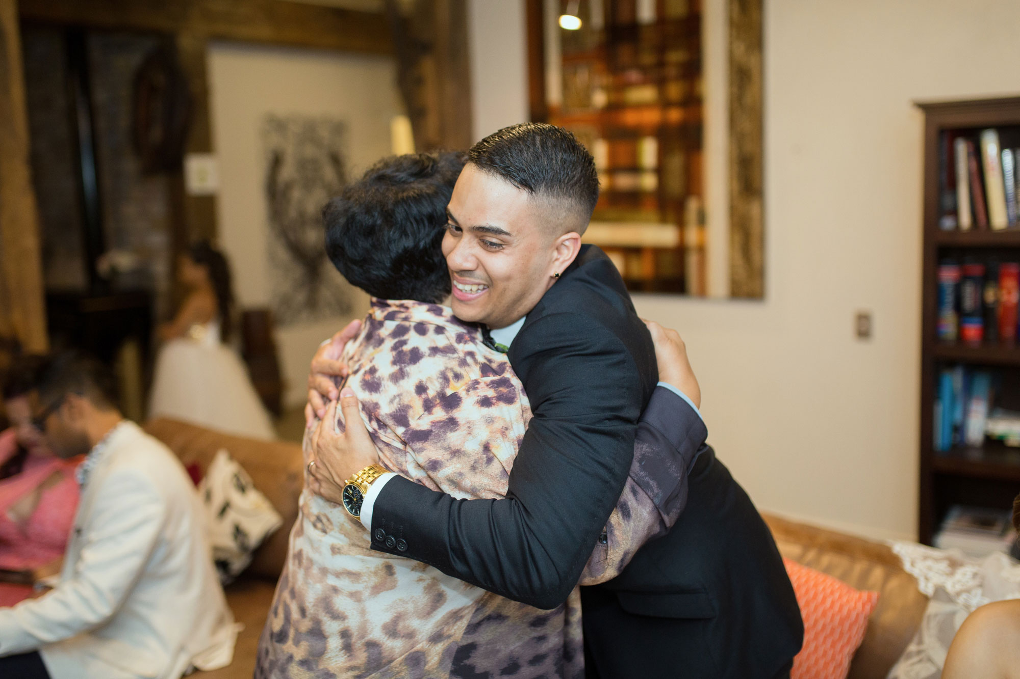 groom hugging guest