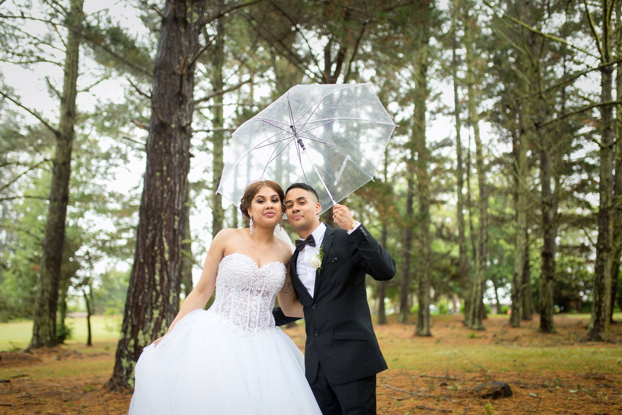 bride and groom rain photo