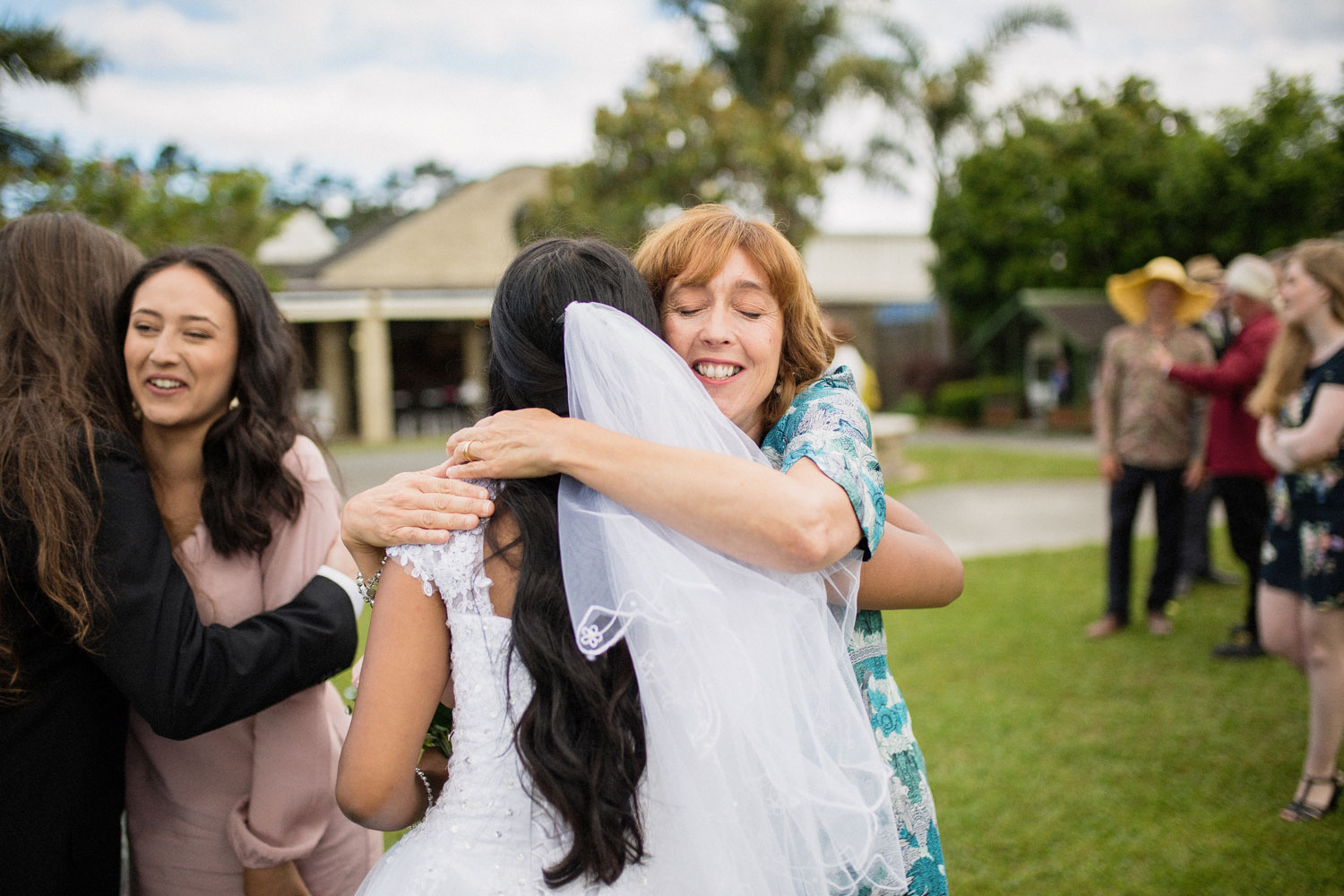 guests embracing bride