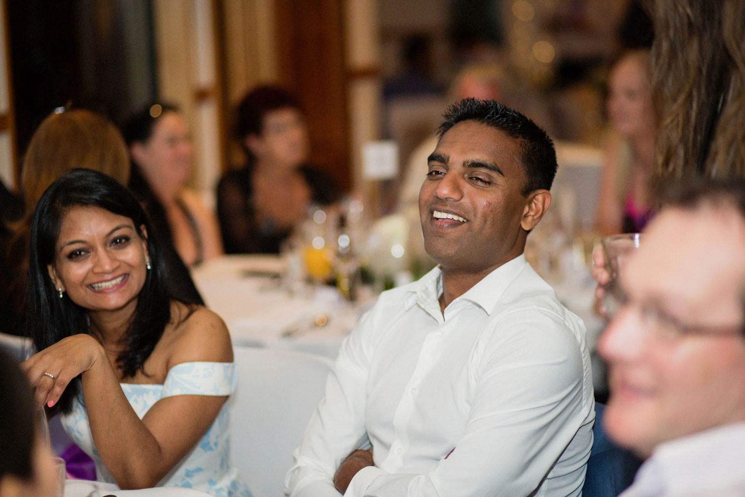 wedding guest smiling