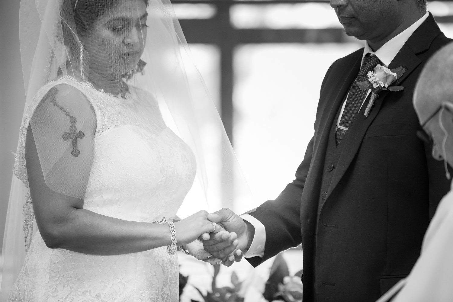 bride holding groom hand