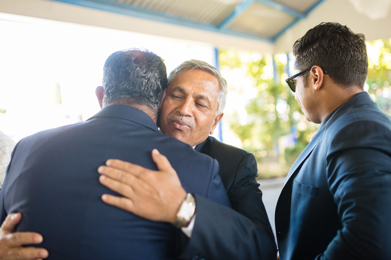 guest hugging groom