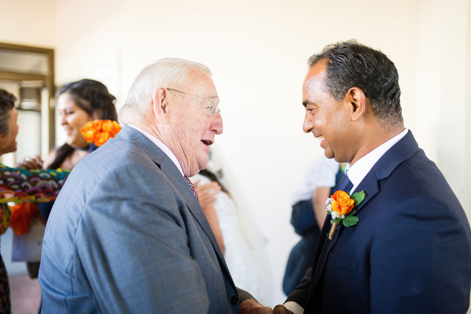 guest talking to groom