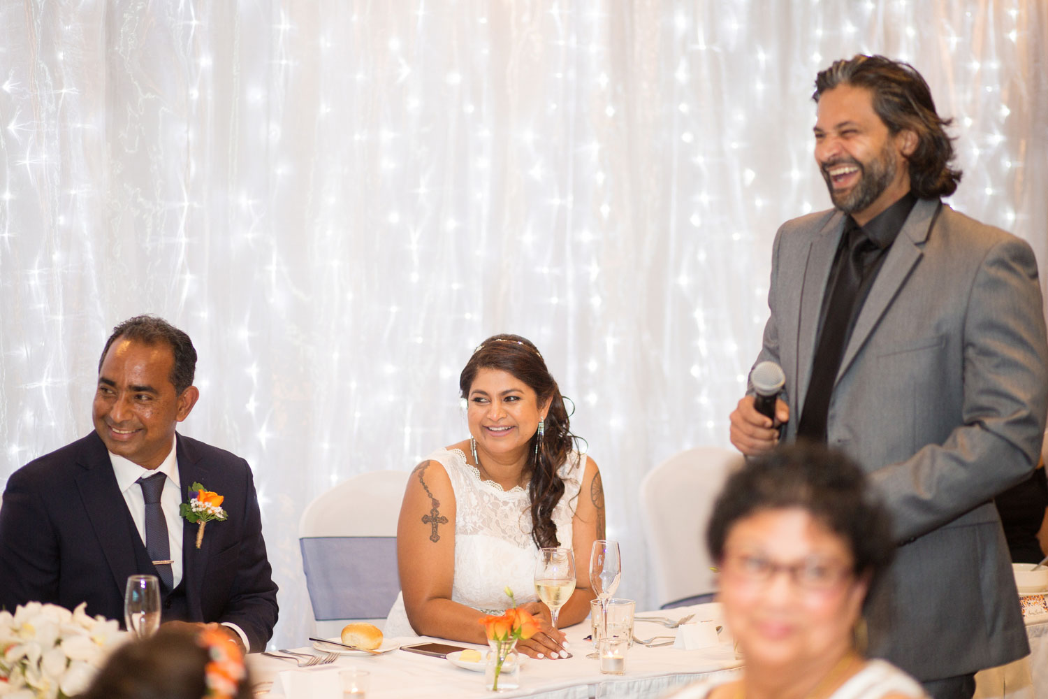 bride and groom laughing