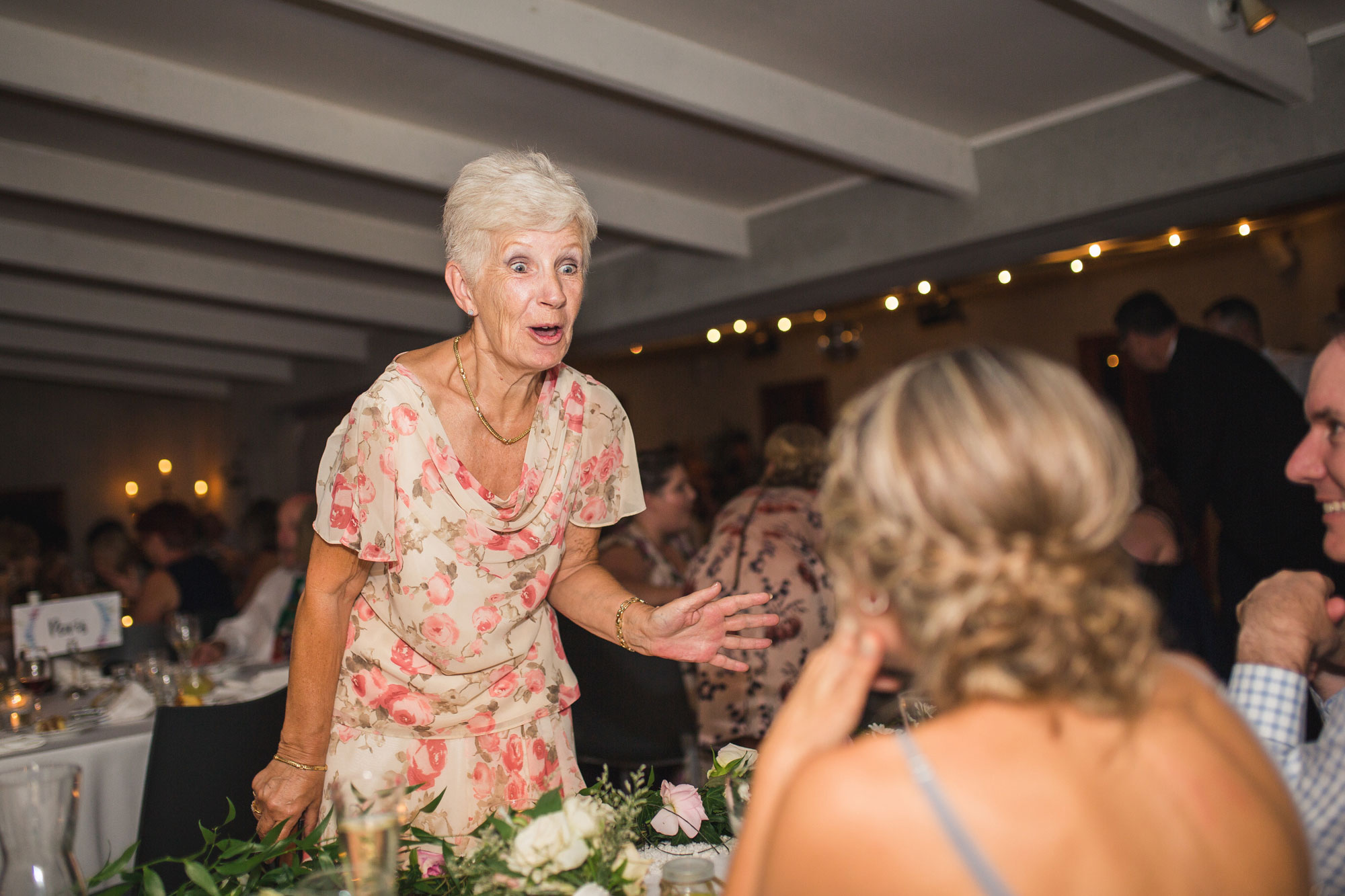 guest talking to bridesmaids