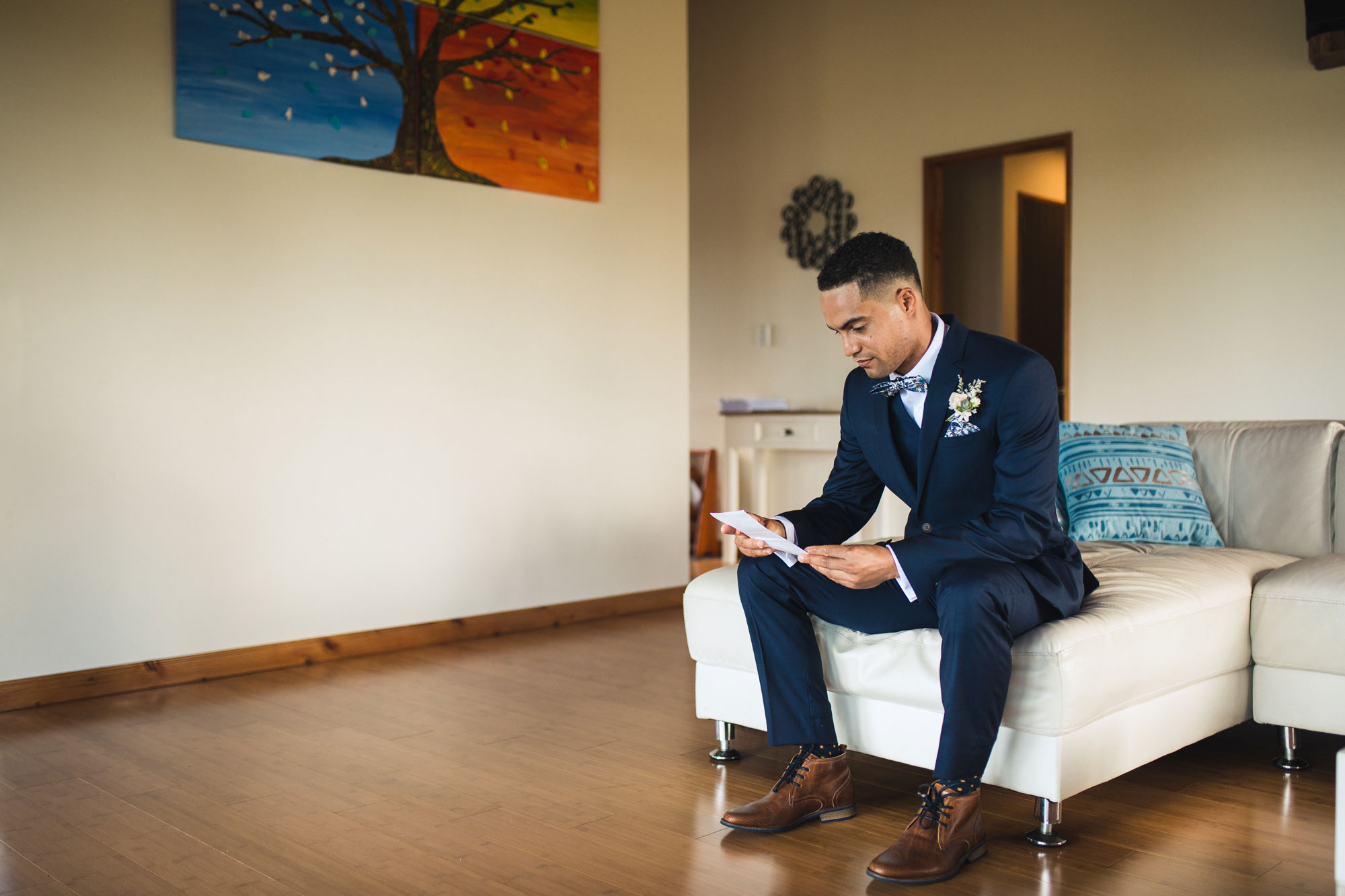 groom reading letter from the bride