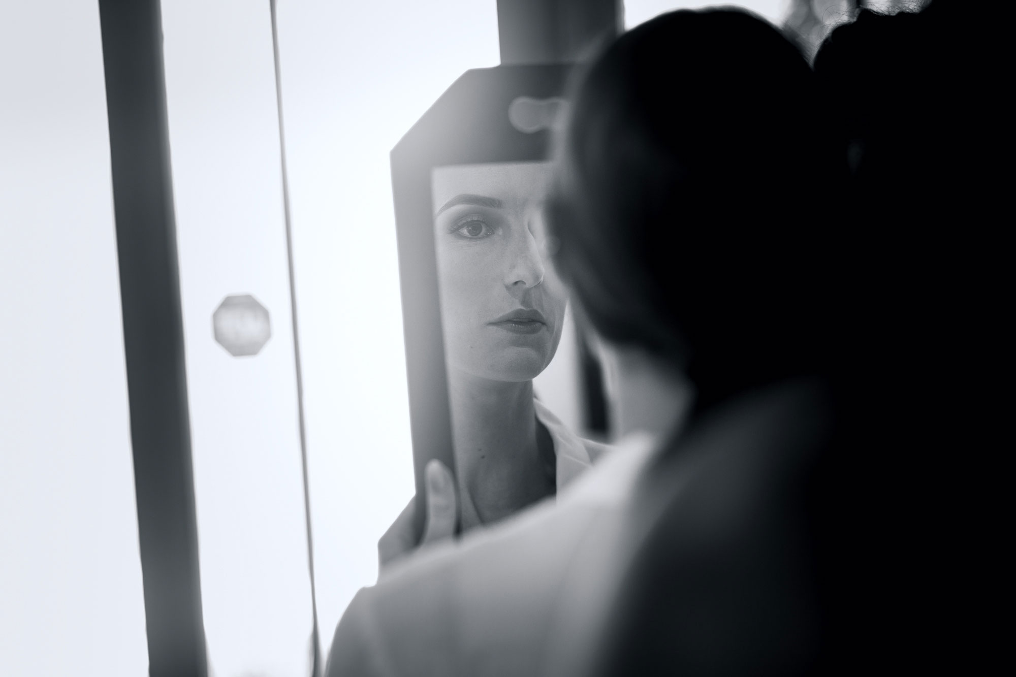 bride looking at mirror