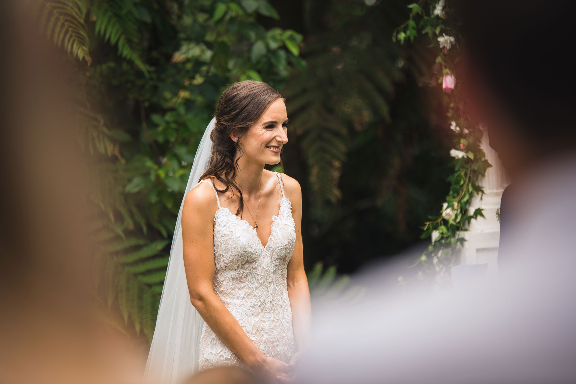 bride smiling at ceremony