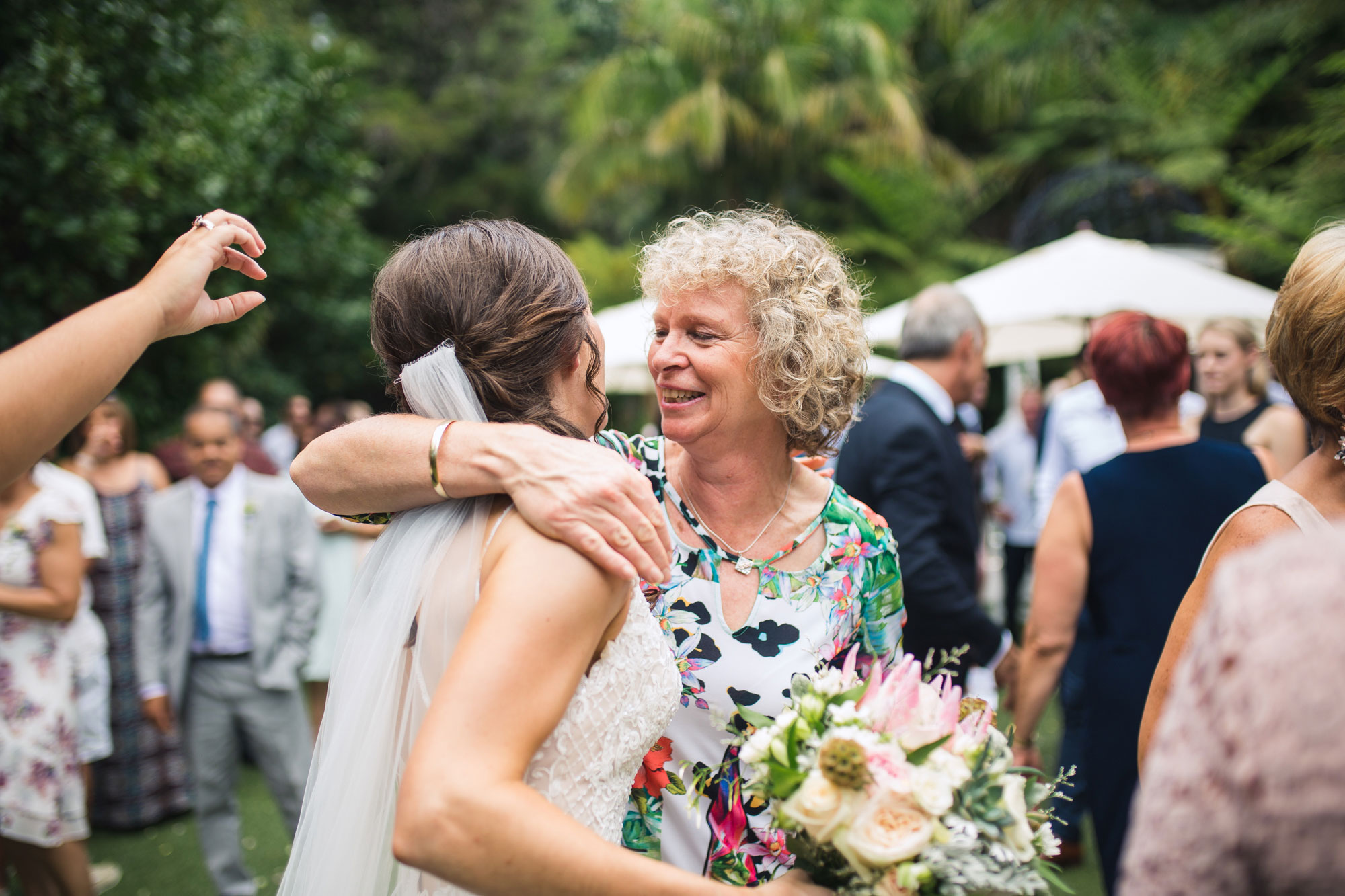 guest hugging the bride