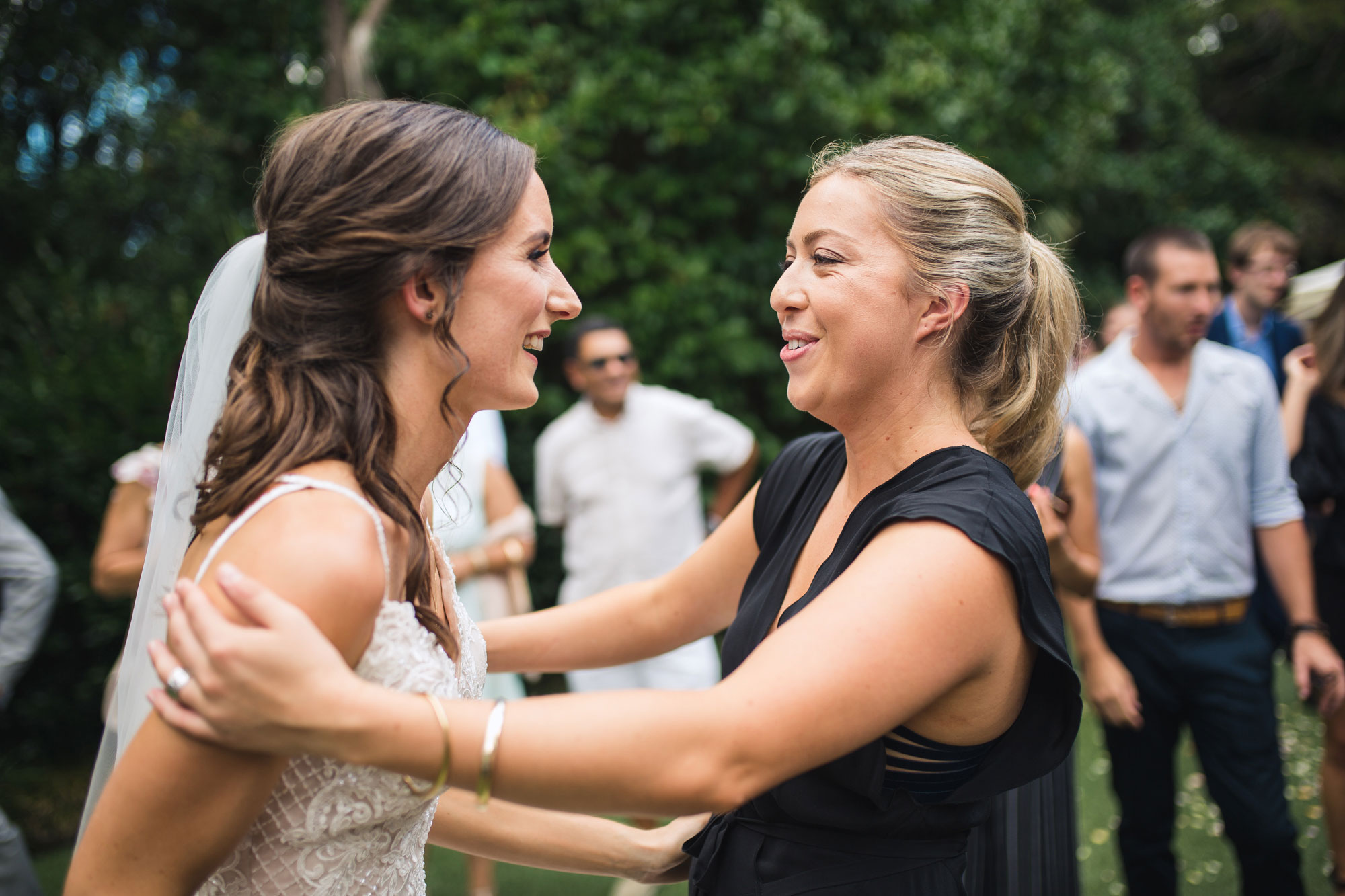 bride and guest smiling