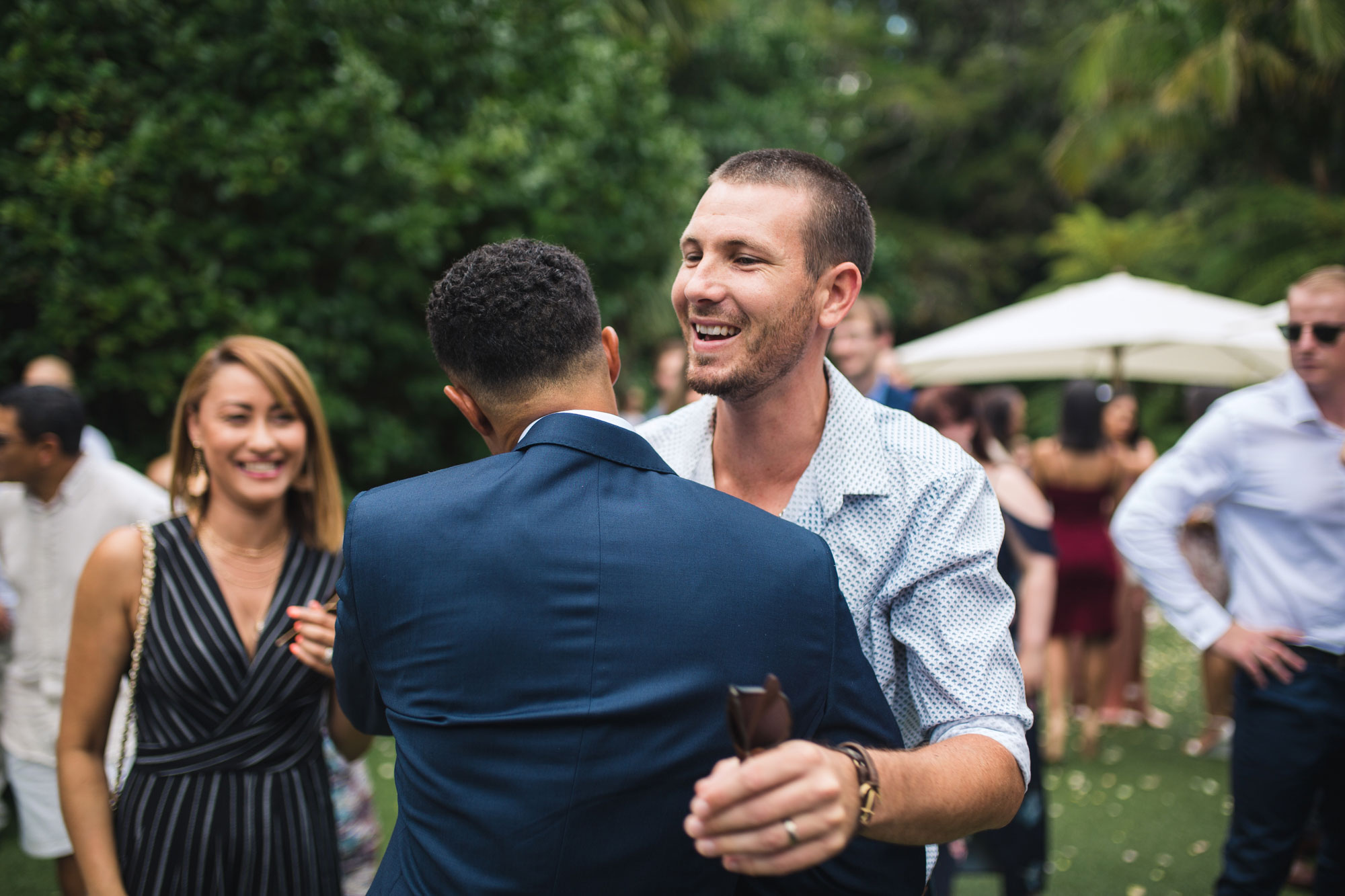 groom and guest smiling