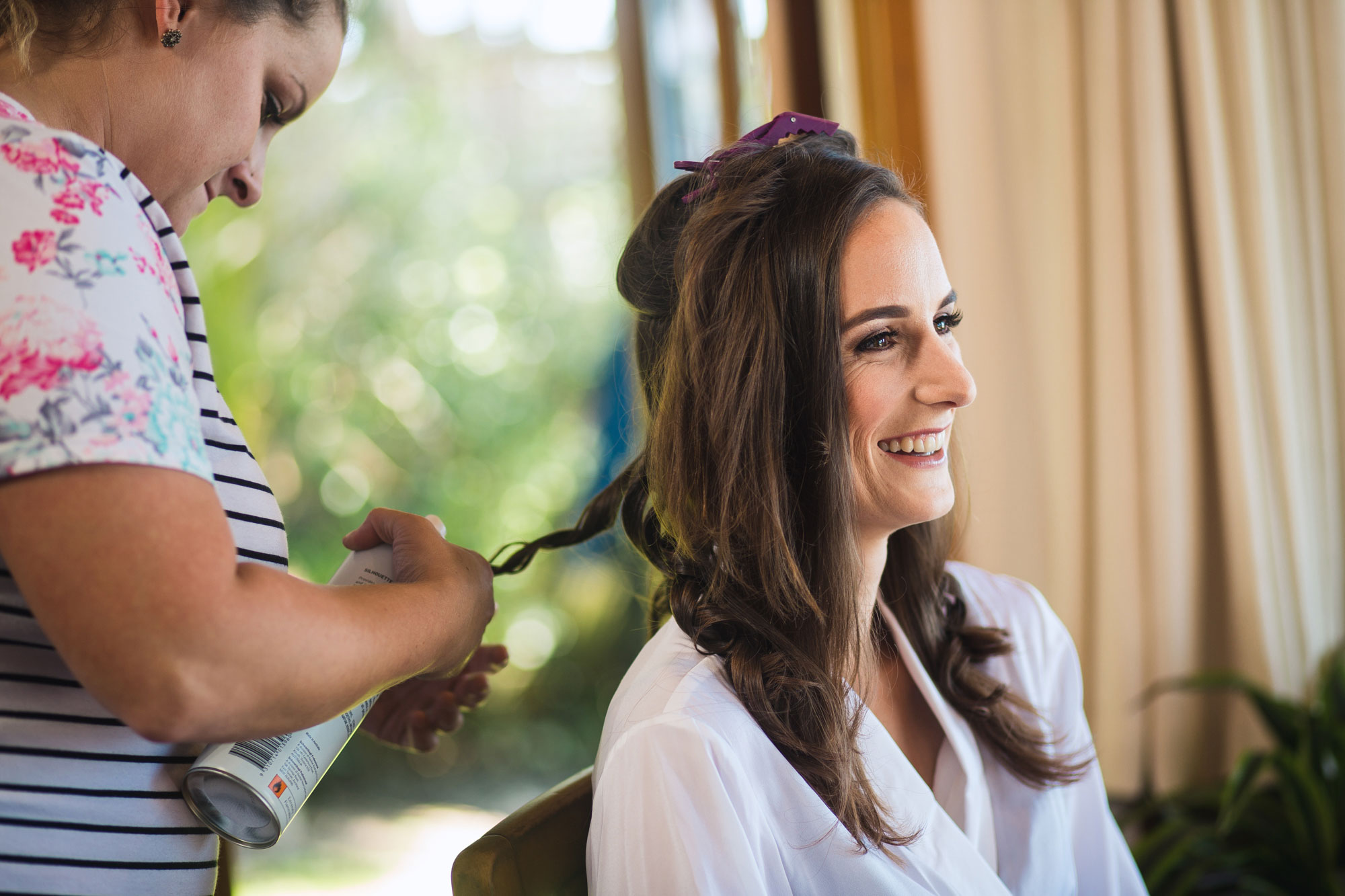 bride getting hair done