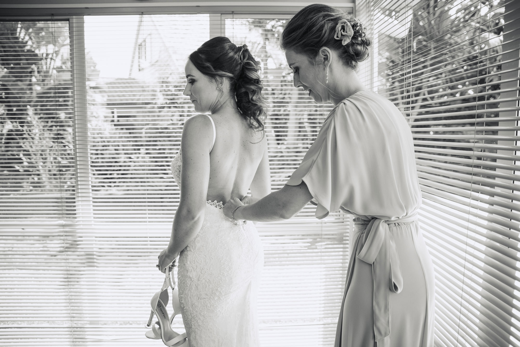 bride getting into her dress