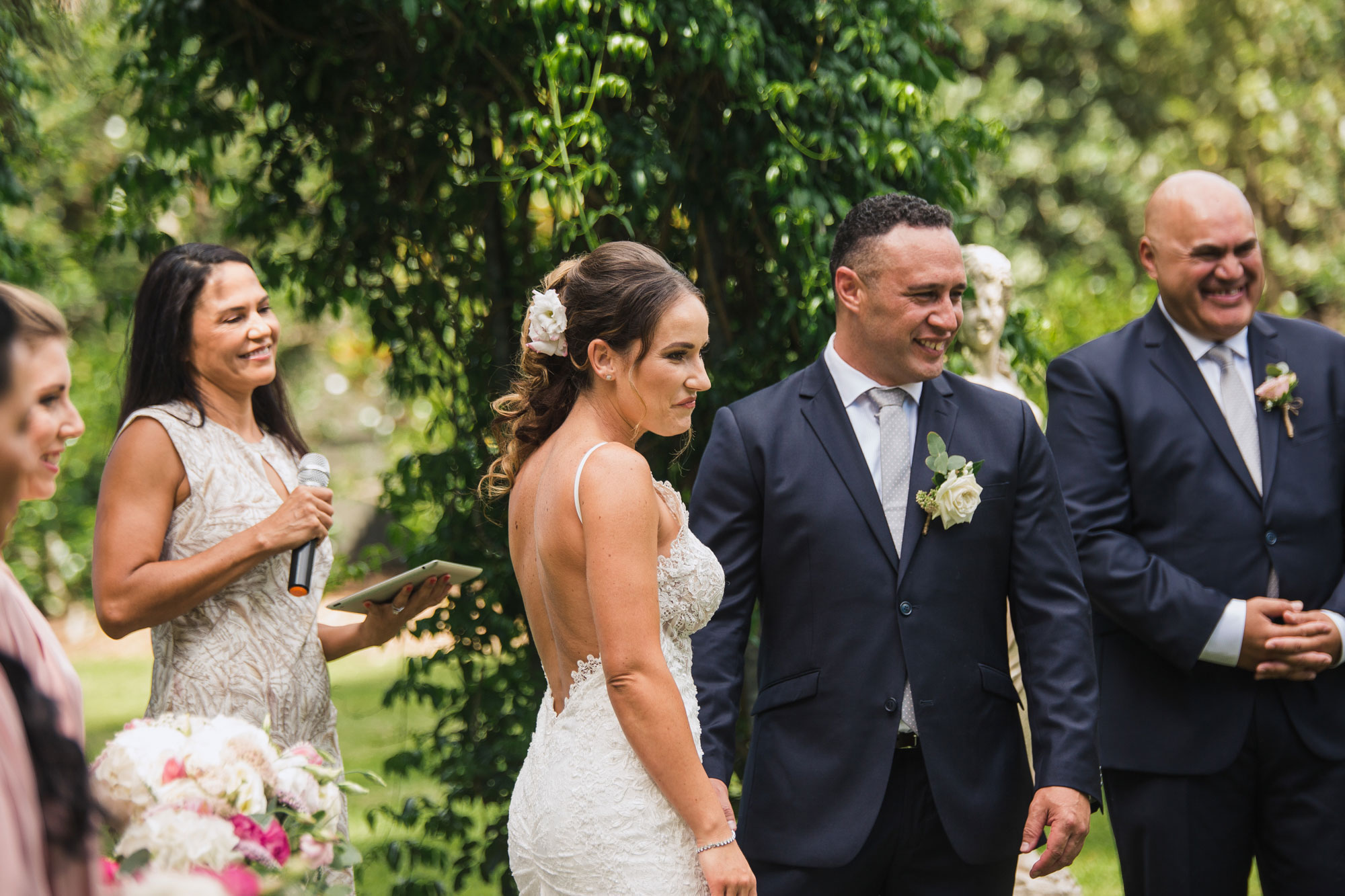 bride and groom looking at ring bearer