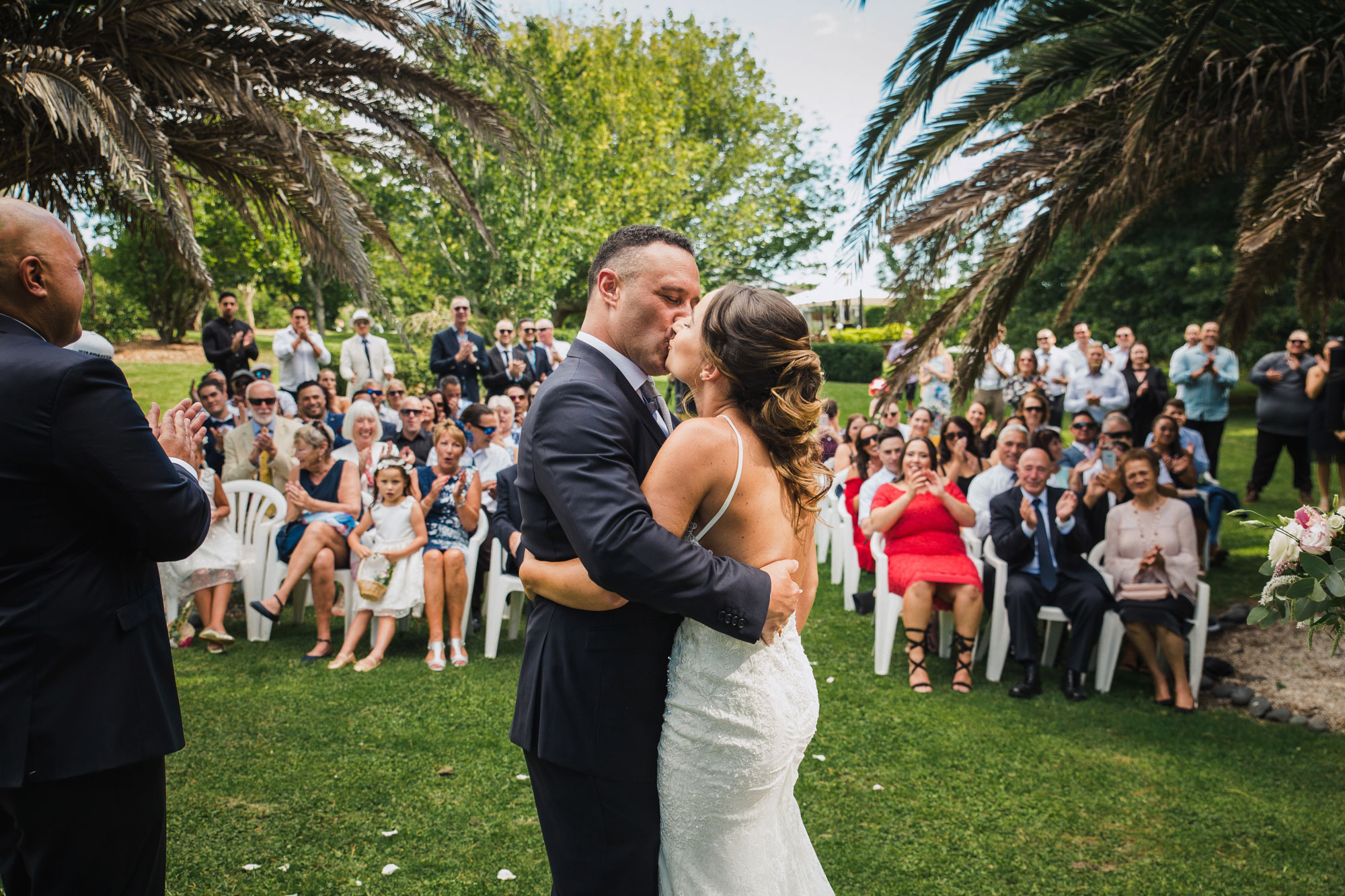 bride and groom first kiss