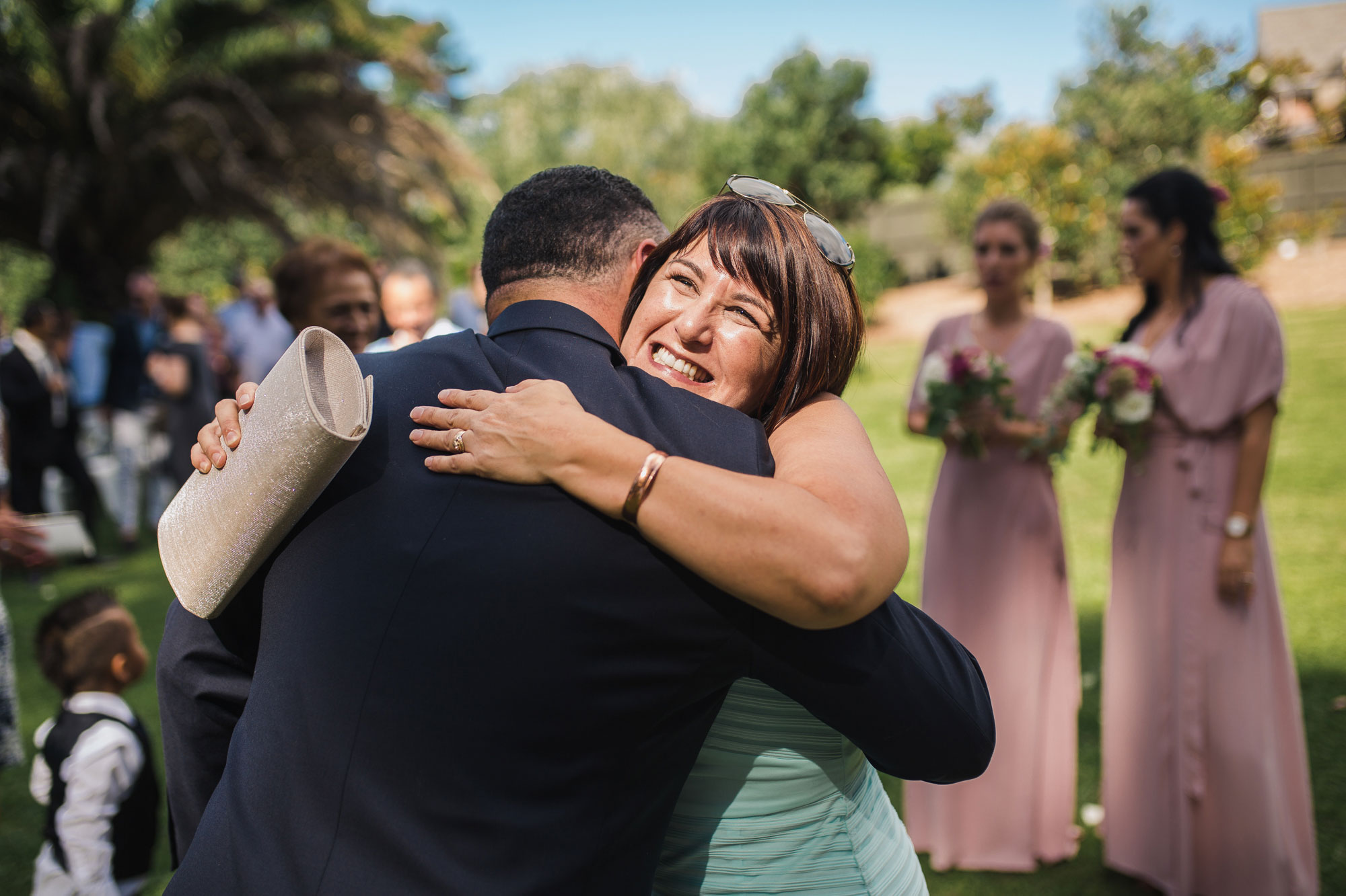 guest hugging groom