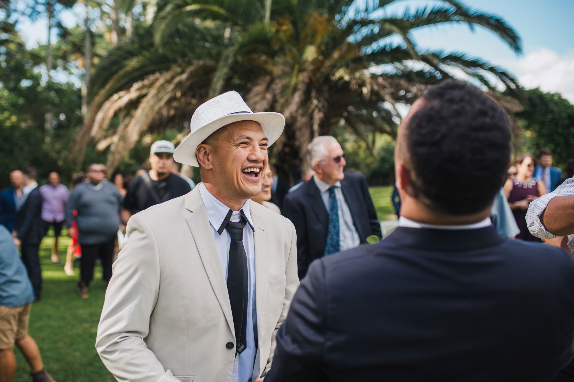 guest and groom having a laugh