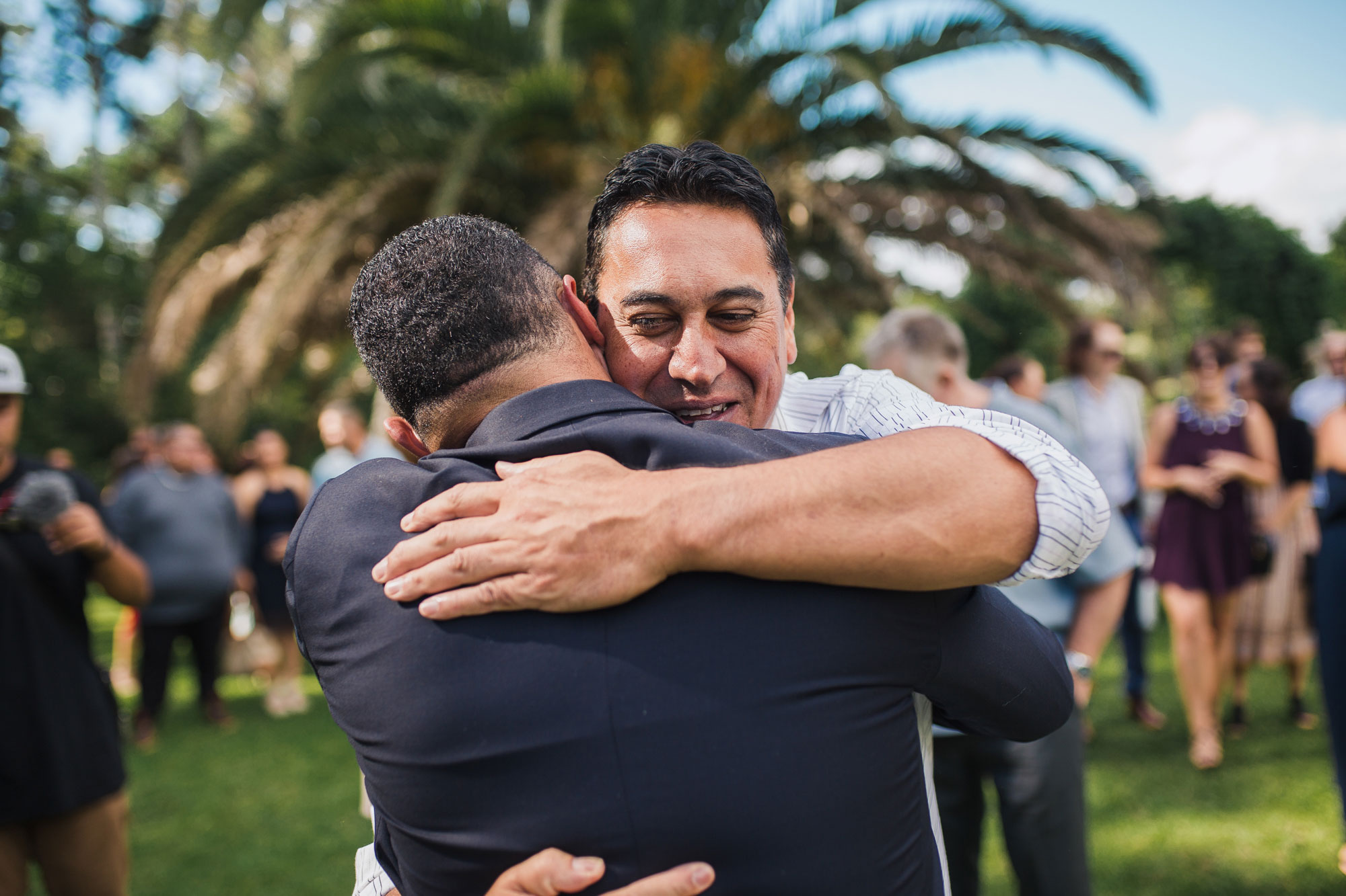 guest embracing the groom